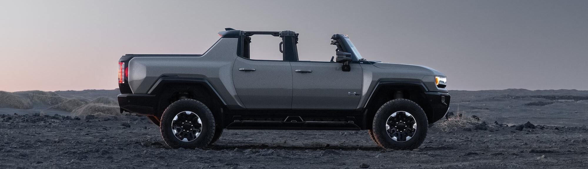 2026 GMC Hummer EV Pickup parked on dirt terrain