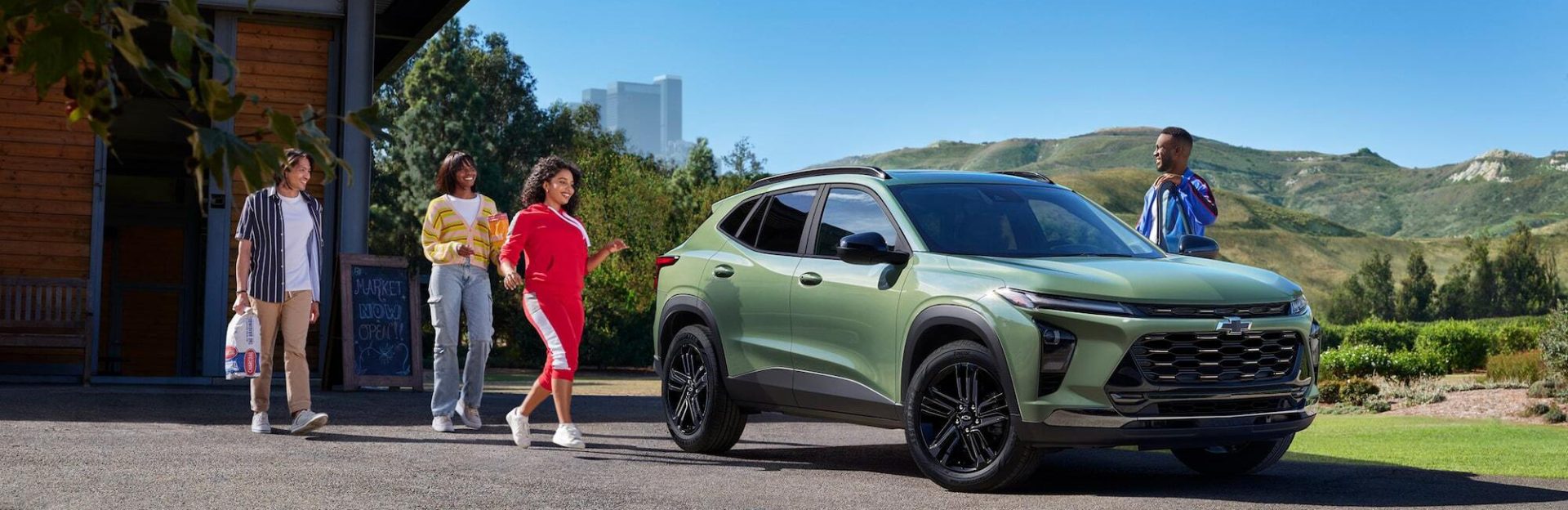 People walking near 2026 Chevrolet Trax parked on pavement